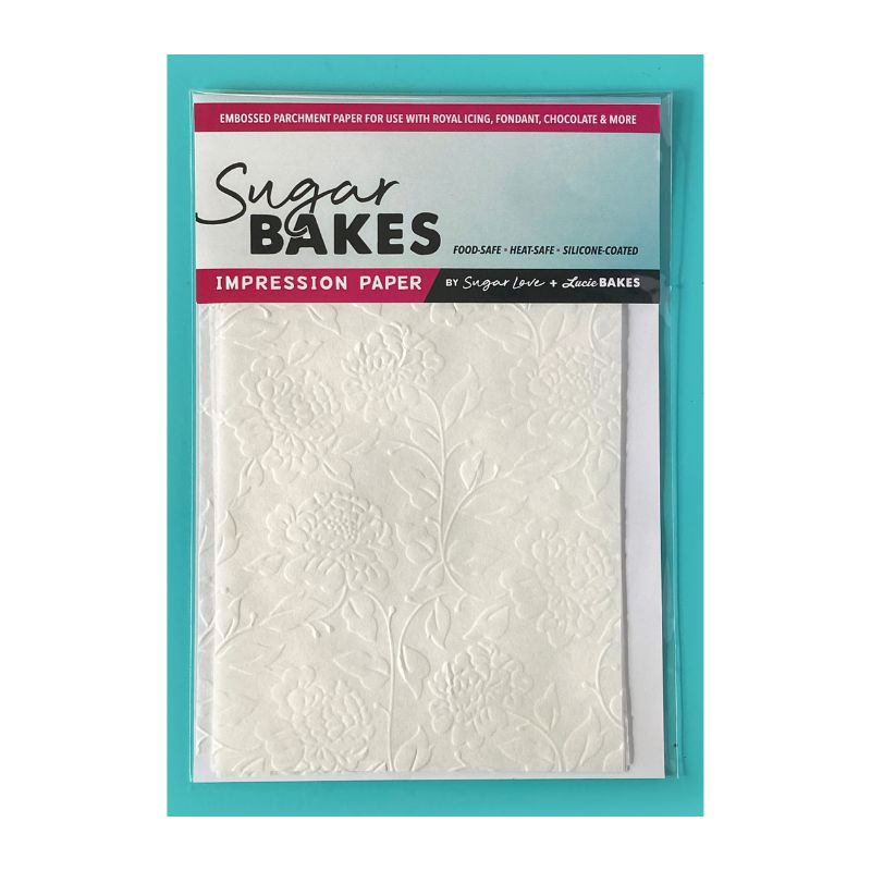 teal background with package with roses and leaves on white parchment and sugar bakes impression paper label