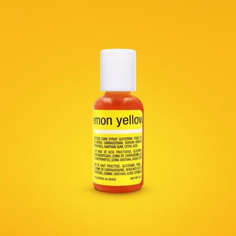 yellow solid background with bottle of lemon yellow food colouring with white lid