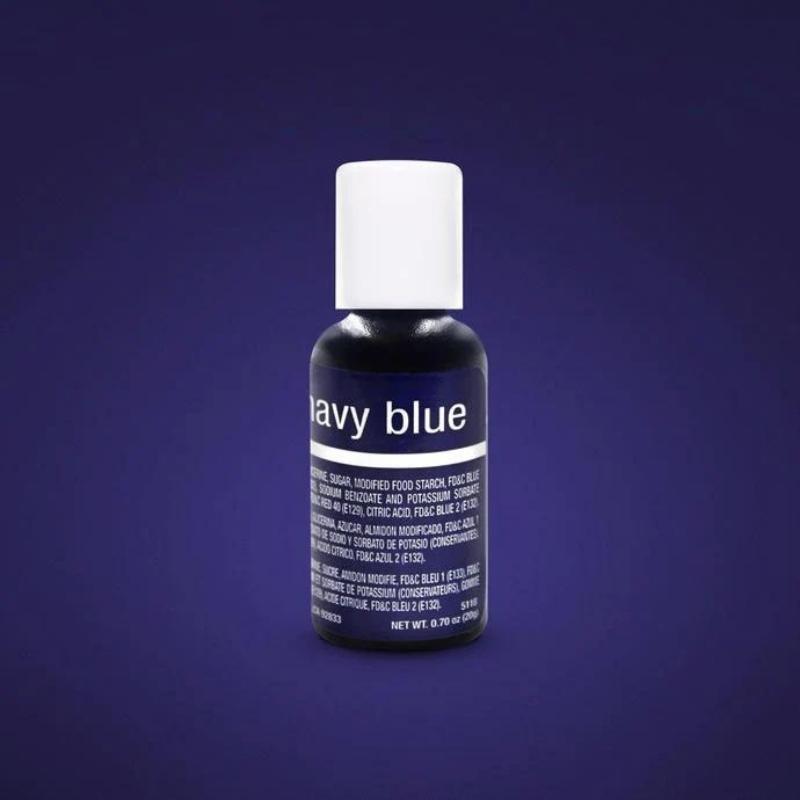 Dark blue background with bottle of navy blue liquid food colouring