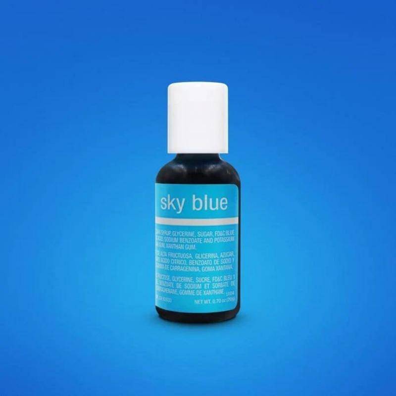 light blue background with small bottle of sky blue liquid food colour and white lid