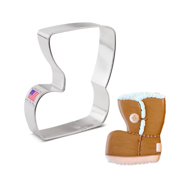 Winter boot cookie cutter that can be turned into an ugg boot and has different shades of brown and warm brown royal icing