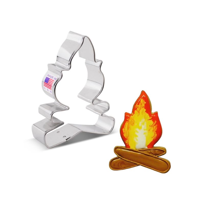 Cookie cutter of fire with logs under used for cutting dough and making decorating cookies for camping themed parties