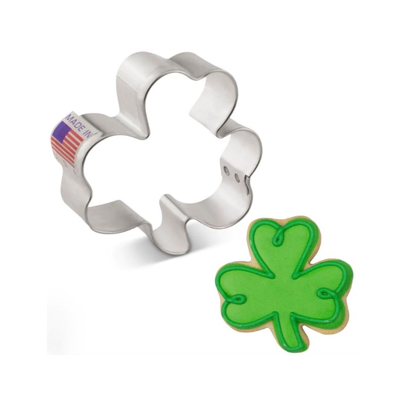 Metal cookie cutter made of metal and in the usa and cookie that is decorated in royal icing in green with details of green