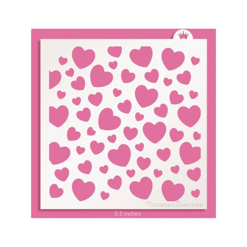 different size pink hearts on white stencil on pink background