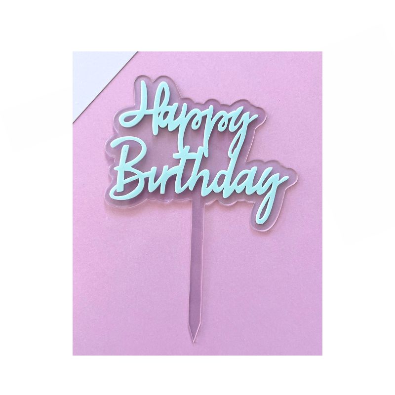 Pastel Blue happy birthday script writing on clear stick on pink background