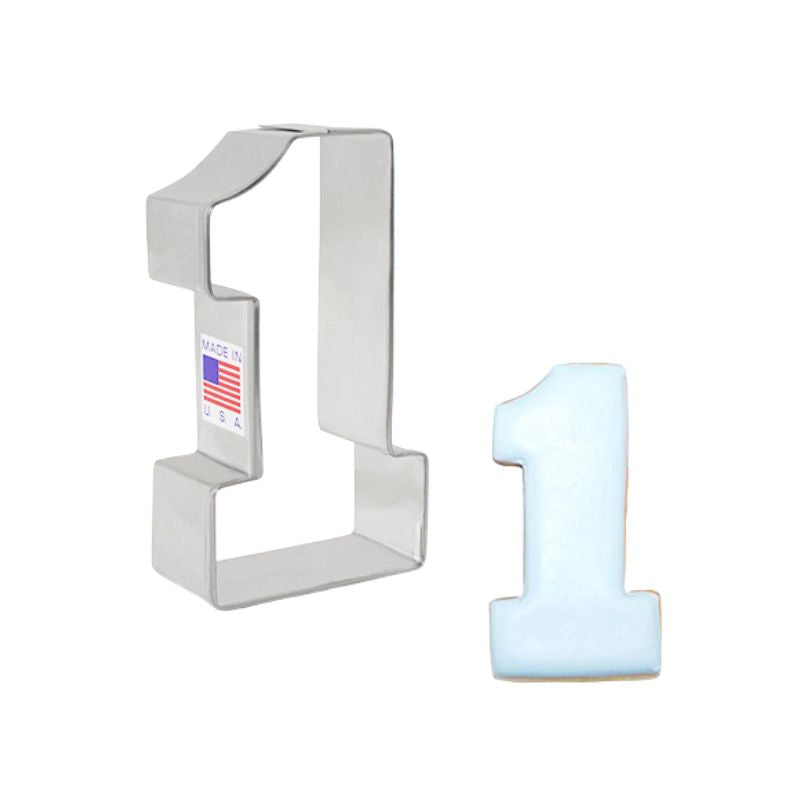 Metal number one cookie cutter with Made in USA and American flag cookie cutter with blue number one cookie decorated with royal icing beside