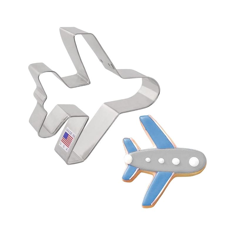 Airplane cookie cutter used for making aviation themed party cookies that are decorated with royal icing