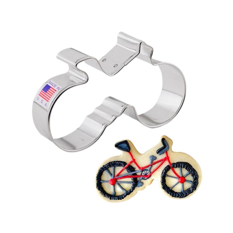 cookie cutter in the shape of a bicycle and used to cut out cookies and decorate with icing made with meringue powder