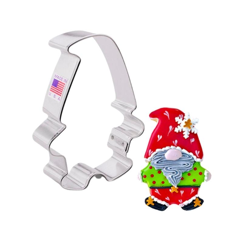 Christmas gnome cookie cutter made of stainless steel and holiday decorated cookie with red and greens with hearts and silver beard