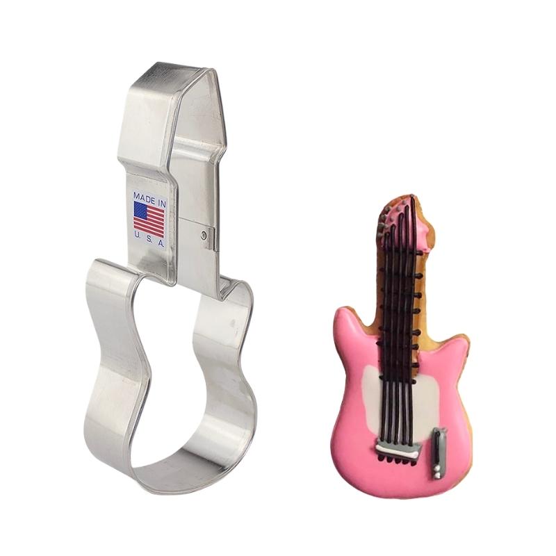 Guitar cookie cutter made of metal and decorated cookie with royal icing with pink and black strings