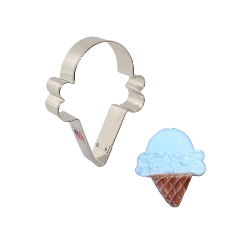 Cookie cutter made of metal with a double scoop royal icing decorated cookie