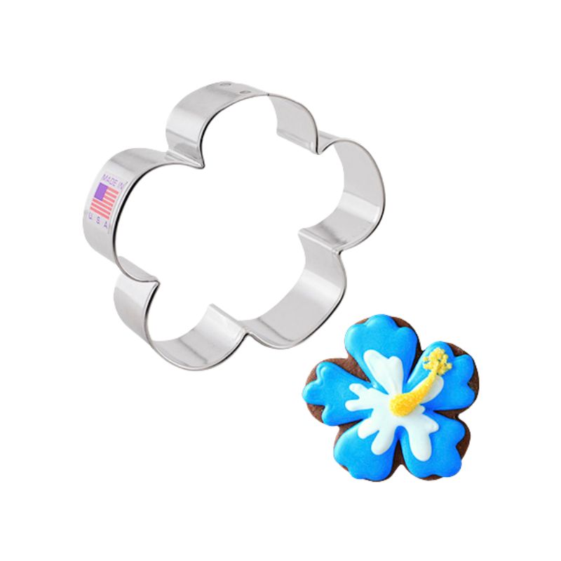 Metal laua flower cookie cutter made in the USA with sticker of flag and cookie beside decorated in blues and yellows royal icing 