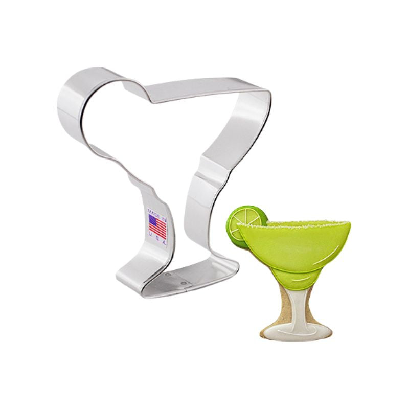 Stainless steel margarita glass made in the USA and cookie in the shape of a margarita glass with a lime on the side and green royal icing