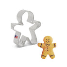Mini gingerbread cookie cutter made in the USA with flag on side of cutter with small gingerbread boy cookie with black icing details