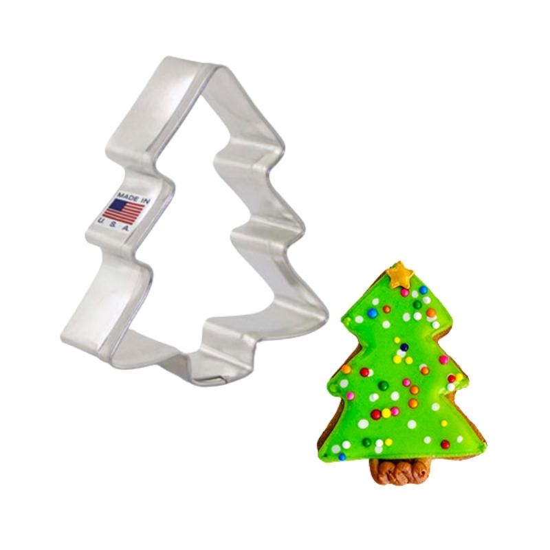 Stainless steel cookie cutter in the shape of a mini Christmas tree and made in the USA with a mini xmas tree with multi coloured polkadots on green icing tree