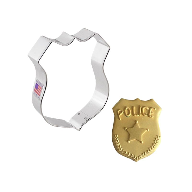 Stainless steel police badge cookie cutter with decorated cookie with gold icing and police written on