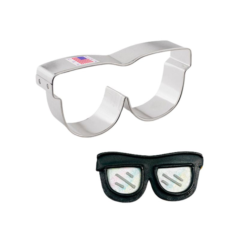 Metal cookie cutter sunglasses made in the USA and next to black decorated sunglasses with silver lens