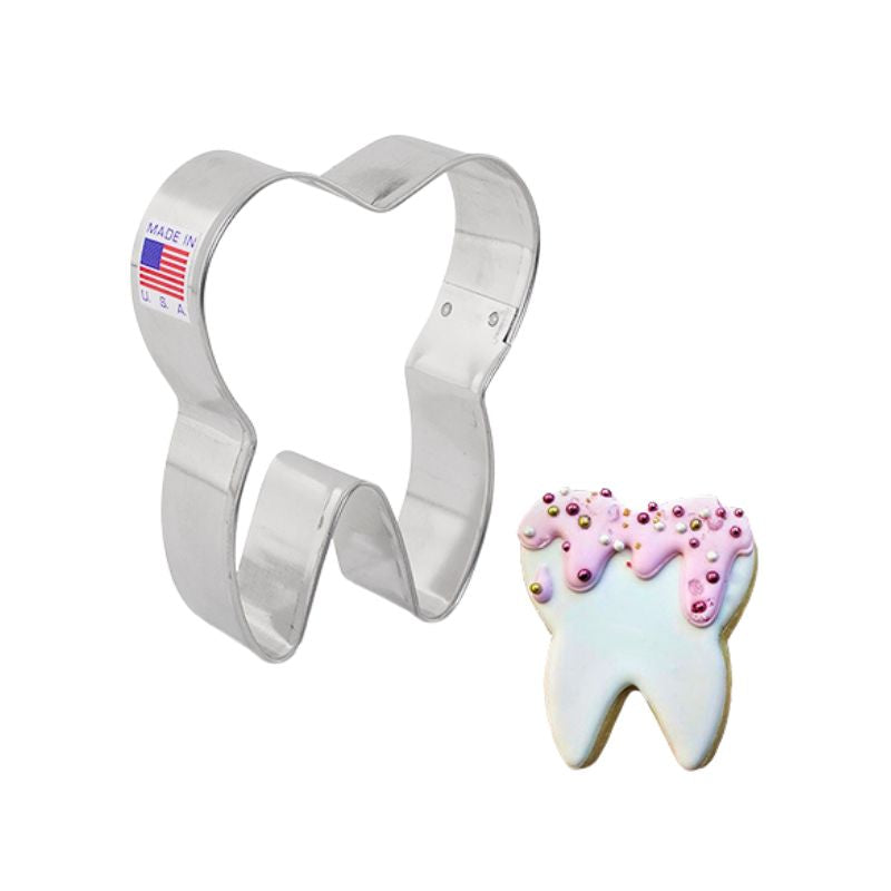 Stainless steel cookie cutter that is made in the USA with flag on beside cookie with royal icing and sprinkles