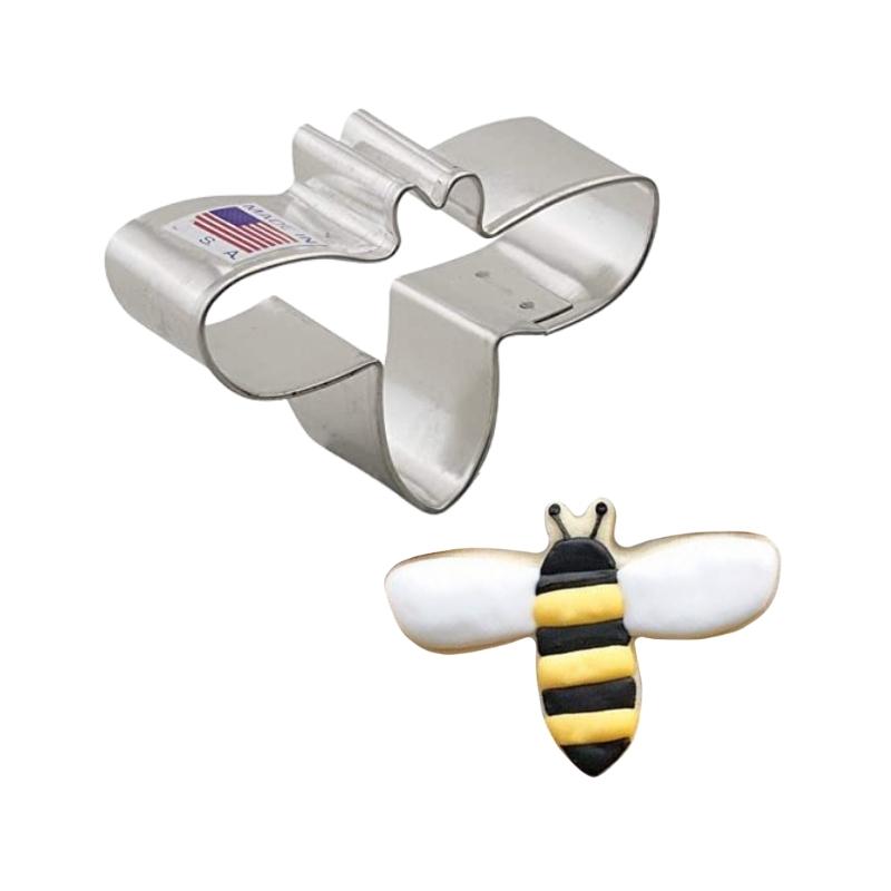 Cute bee stainless steel cookie cutter used for making bee shaped cookies that are decorated with royal icing