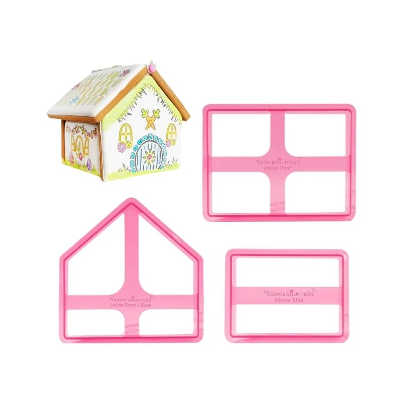 gingerbread house with 3 pink house cookie cutters beside