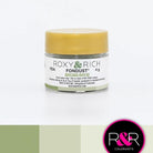 Container with gold lid and white label that has roxy & rich Fondust Avocado writing and different shades of avocado on the bottom