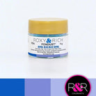 Container with gold lid and white label that has roxy & rich Fondust royal blue with multiple shades of royal blue on the bottom