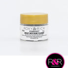 Container with gold lid and white label that has roxy & rich Fondust black writing